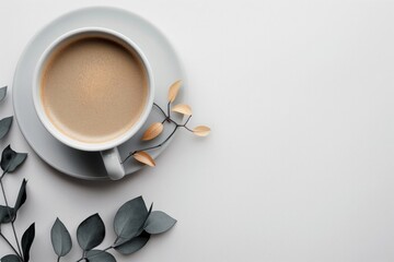 Obraz na płótnie Canvas Coffee Cup with Eucalyptus Decoration on White Background