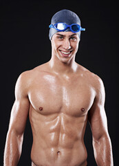Man, studio and portrait with happy swimmer, workout and exercise with athlete for cardio health. Wellness, confident and male person with swimming cap and goggles, black background for sport