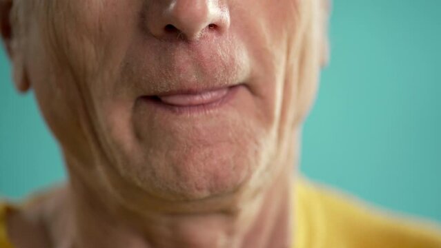 Close-up of old man suffering an anxiety attack, hard breathe