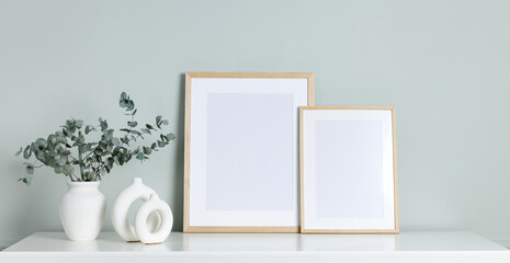 Blank picture frames template on a wall