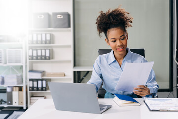 Confident business expert attractive smiling young woman holding digital tablet  on desk