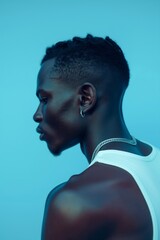 Intense Profile Portrait of a Young African American Man in Blue Light