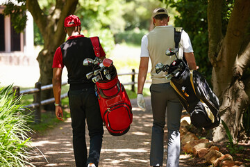 People, walking and outdoor in park for golf, game and training together at club in summer. Golfer,...
