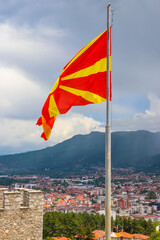 Flag of North Macedonia against blue sky
