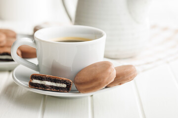Freshly Brewed Coffee in Cup With Chocolate Cookies on Saucer