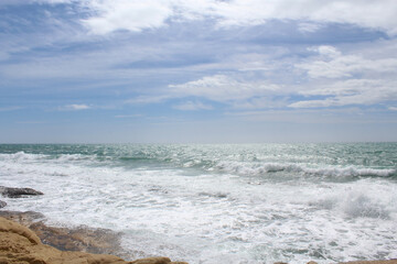 Fototapeta na wymiar beautiful view of seashore,waves on the beach, travel