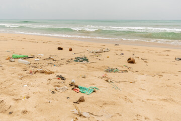 Sri Lanka, Bottles of plastic and garbage on the sand on the beach near the ocean, sea pollution...