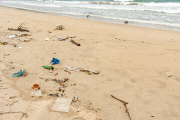 Sri Lanka, Bottles of plastic and garbage on the sand on the beach near the ocean, sea pollution catastrophe.