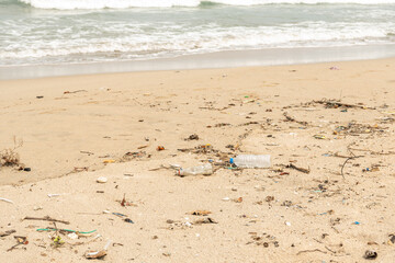 Sri Lanka, Bottles of plastic and garbage on the sand on the beach near the ocean, sea pollution catastrophe.
