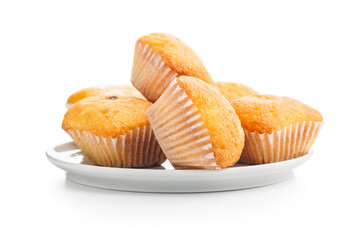 Magdalenas the typical spanish plain muffins on plate isolated on white background.