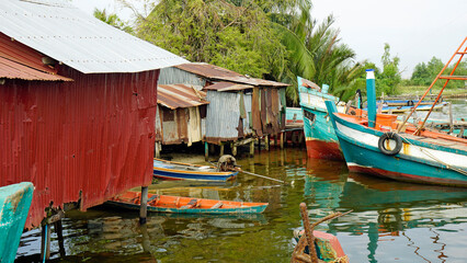 colorful fisher boats in a harbor in kampot