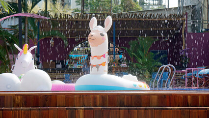 inflatable swimming toys at a pool bar