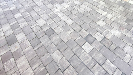 Grey brick wall background close up. Gray stone tile block backgroun