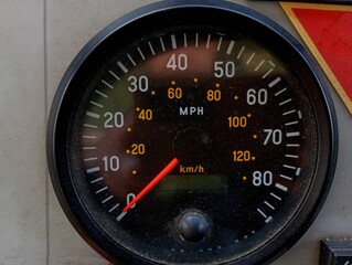 Car round black old speedometer with a scale and arrows moving in a circle. Automotive devices and devices for measuring speed.