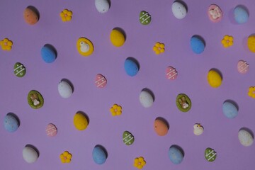Easter decoration in a row isolated on lavender colored background. 