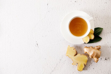 Ginger tea with ginger root and ginger slices.