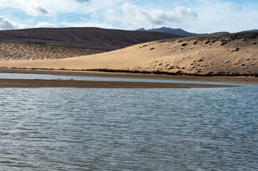 View on sandy dunes and turquoise water of Sotavento beach, Costa Calma, Fuerteventura, Canary...