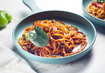 Chinese noodles with tomatoes, herbs, garlic and tomato sauce