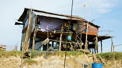 poor fisherman village at the shore of tonle sap river in cambodia