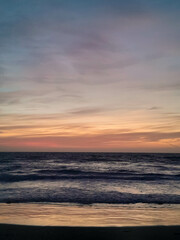 Amazing sunset over sea in Golden Bay Malta.