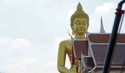 golden buddha statue near chao praya river in bangkok