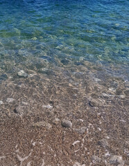 Beach. Crystal clear sea water and sand.