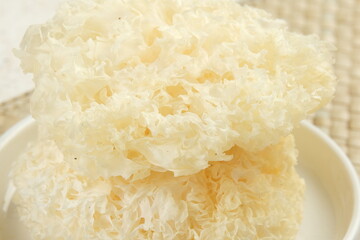 Close up,Dried snow fungus (Tremella fuciformis) on white background