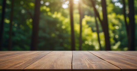 Fototapeta premium Empty wooden table top with blurred green nature forest background for product placement. Product background