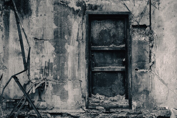 door and wall of a destroyed and burnt house in Ukraine