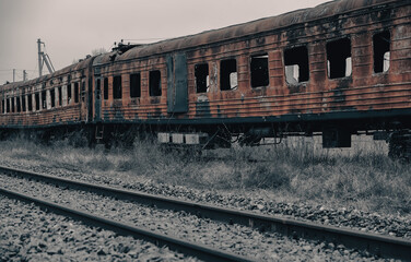 Fototapeta premium burned out blown up wagons in Ukraine