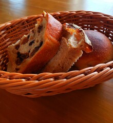 Close up of fresh raisins bread in the basket for lunch at the restaurant 