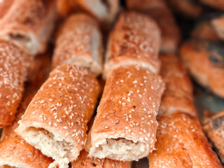 Small boreks ор bourekas with sesame seeds sold in a bakery store