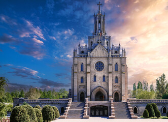 facade of Cathedral of Sacred Heart of Jesus on background of a morning sky at sunrise in spring....