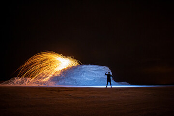 Long exposure photography with light painting technique. Art with lights. Human silhouette