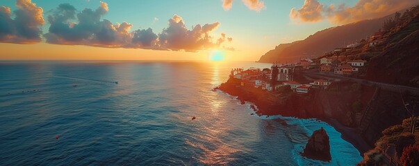Aerial drone view of Ponta do Sol town during sunset, at the south coast of Madeira island, Portugal.