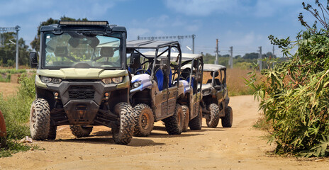 4x4 quad bikes park off-road waiting for safari with tourists
