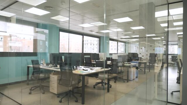 Interior of bright creative coworking workspace with computer desks