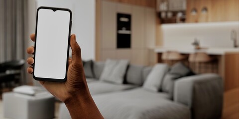 African-American Hand with smartphone in modern home, perfect for smart home app