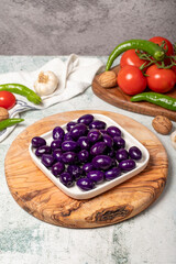 Purple or blueberry olives. Purple olives for breakfast in a plate