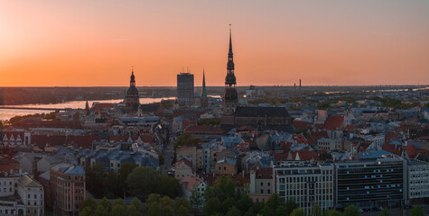 Aerial panoramic sunset over Riga old town in Latvia. Beautiful spring sunset over Riga. Golden...