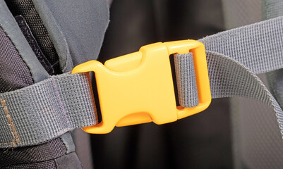 Yellow plastic clasp of backpack