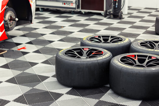 Oschersleben, Germany. 29th April, 2024. Sport racing Pirelli P zero tires wheels bbs set  mount paddock pits area motorsport race track. Stacked sports tyres supercar  circuit asphalt competition