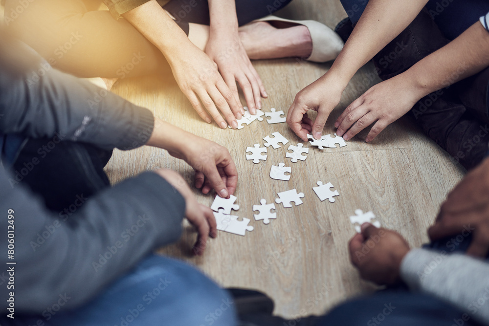 Poster People, training and hands with puzzle on table for problem solving, learning and integration of strategy. Diversity, team and support with jigsaw for creative teamwork, interaction and collaboration