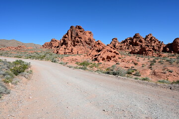 Unpaved road running through The Valley fo Fire state park in Nevada, USA.