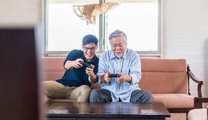 Portrait of happy love asian family senior mature father and young adult son having fun enjoying...