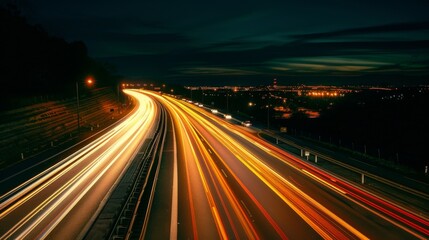 Obraz premium Nighttime long exposure of a road. A vibrant long exposure shot capturing the dynamic lights of cars traversing a road at night, reflecting the urban pulse