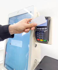 Customer pays his purchase at the supermarket,self checkout systems in  retail stores,Barcode scanner,Self checkout machine