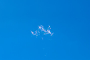 Beautiful white clouds against a blue sky background. High resolution.