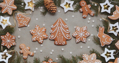 Christmas Gingerbread Cookies Decorative Icing Pine Cones Star Lights Top View Gray Background