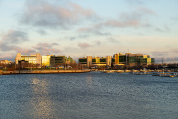 General view across the Louise Basin with modern and patrimonial buildings in the background seen during an early spring golden hour morning, Quebec City, Quebec, Canada